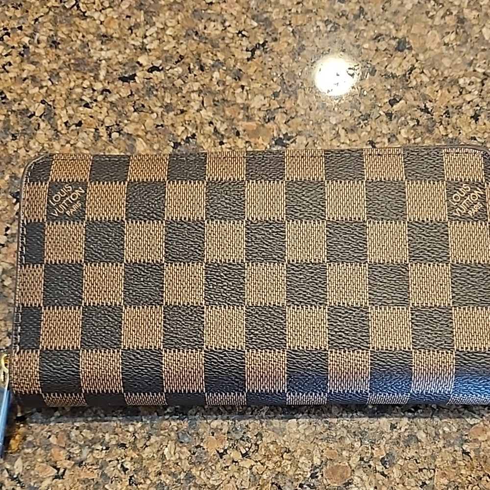 Louis Vuitton Damier Ebene Wallet..comes with dust bag. Never used.